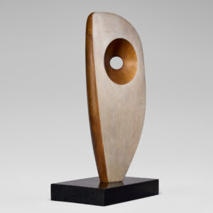 A carved wooden sculpture in an abstract shape.