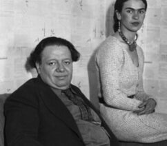 A black-and-white photograph of Diego Rivera and Frida Kahlo.