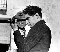 A photo of a man using a hand-held camera