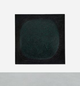 A black-and-green painted canvas poked with holes.