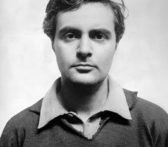 A black-and-white photographic portrait of a man, Amadeo Modigliani