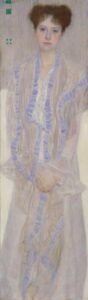 A portrait of a young woman in white and purple dress.