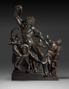 A bronze sculpture of three figures being strangled by snakes.