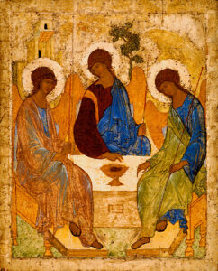 A medieval orthodox icon showing three angels sitting around a table.