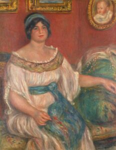 A portrait of a woman against a red background.