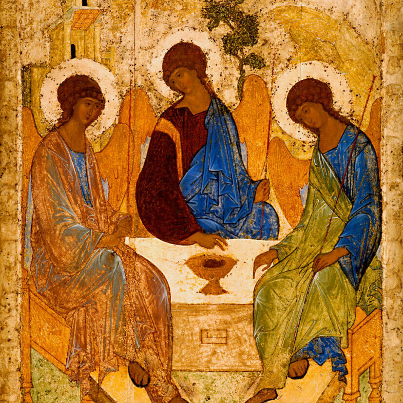 A medieval orthodox icon showing three angels sitting around a table.