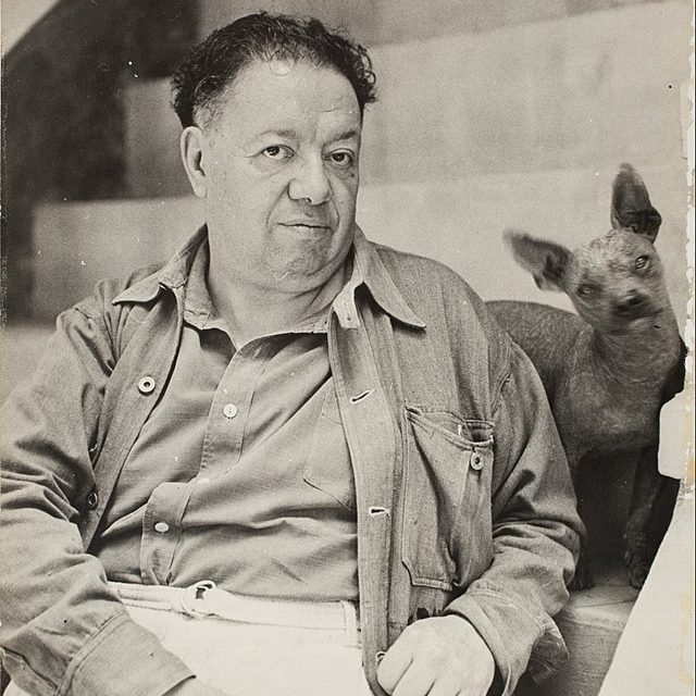 A photograph of Diego Rivera and his xolo dog