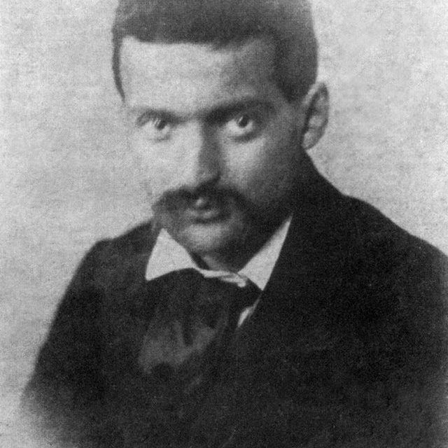 A black-and-white photograph of the painter Paul Cézanne at age 22