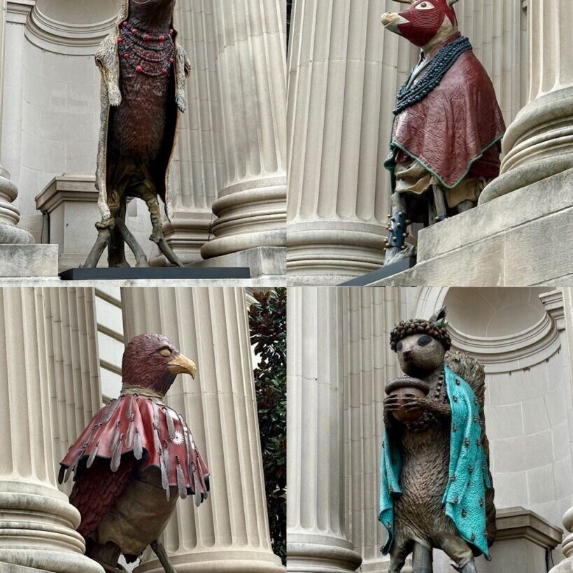 Four animal sculptures in niches on the facade of the Metropolitan Museum.
