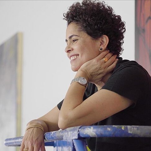 A photo of the artist Julie Mehretu in her studio.