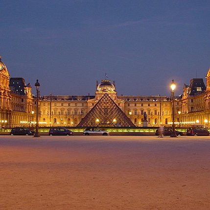 The Louvre at night, with I.M. Pei's famous glass pyramid outside