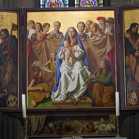 A religious triptych painting with a Madonna & Child in the center