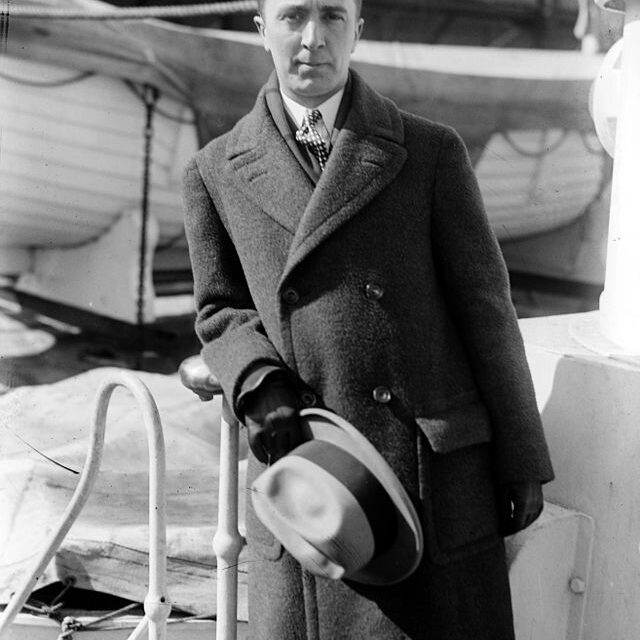 A black-and-white photograph of Norman Rockwell