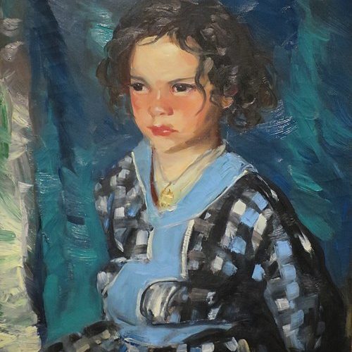A young girl in a blue dress