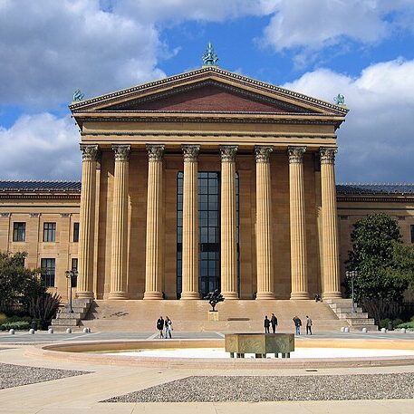 A large building with a classical-style columned portico