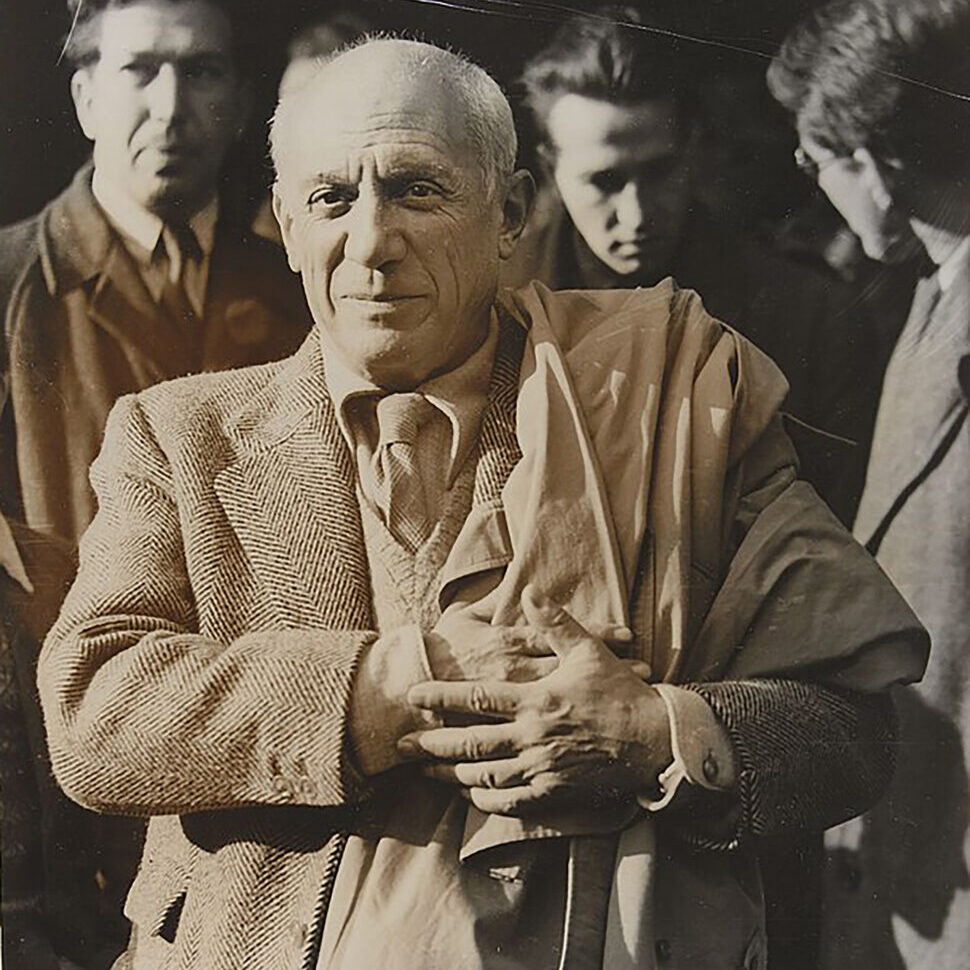 A black-and-white photograph of Pablo Picasso.