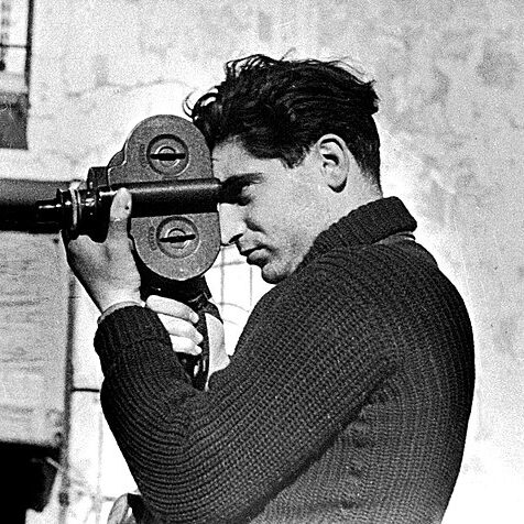 A photo of a man using a hand-held camera