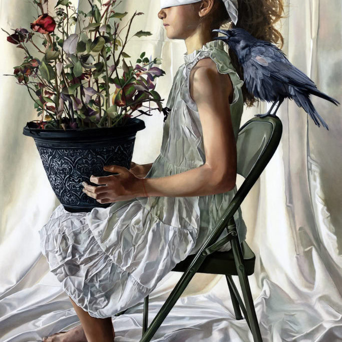 A young girl seated on a chair holding a plant and a girl on the back of the chair