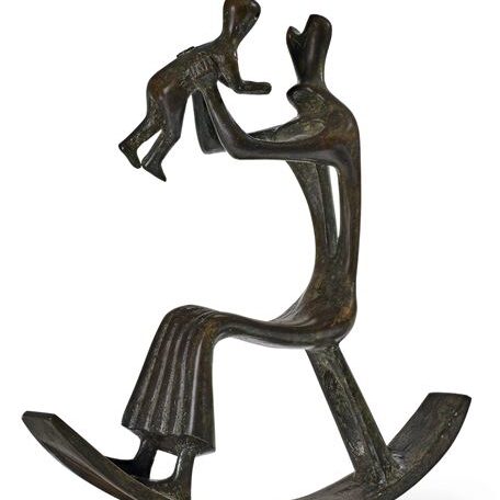 An abstract bronze sculpture of a person in a rocking chair holding up a child.