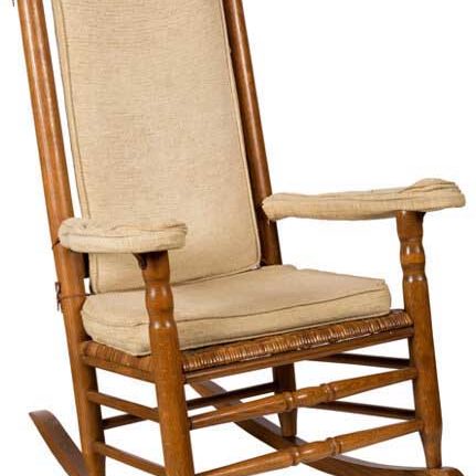 wood rocking chair with beige seat and back cushions