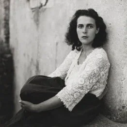 A black-and-white photograph of a young woman, Leonora Carrington
