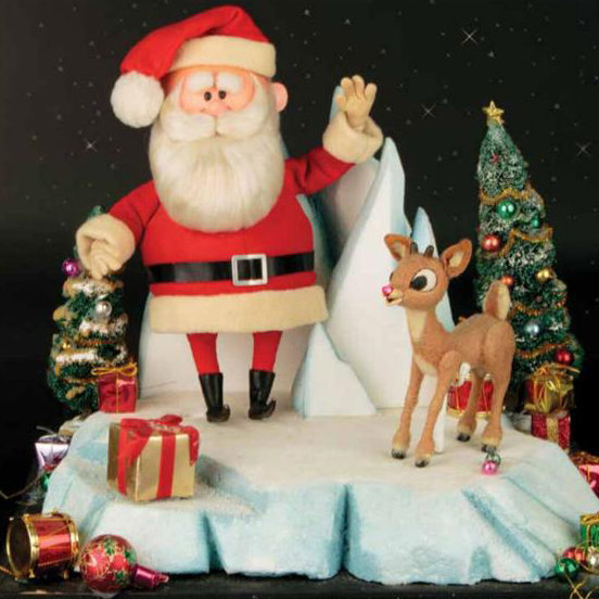 Santa Claus and Rudolph the red nosed reindeer standing on snow with presents