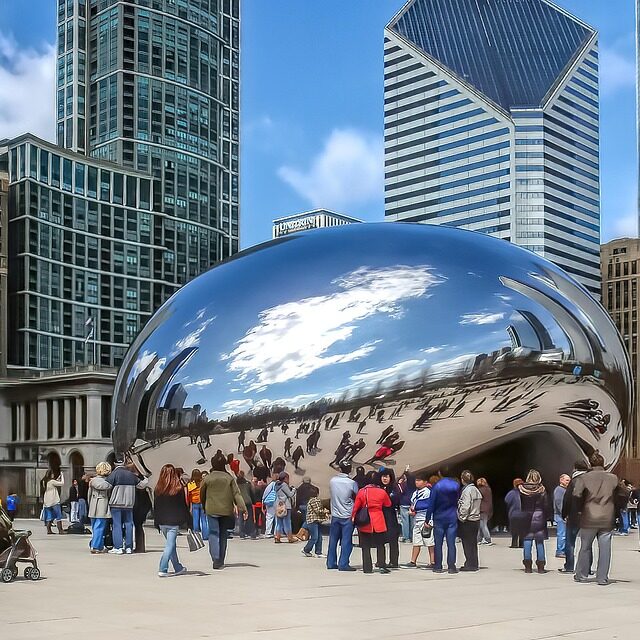 A large stainless steel sculpture in a public plaza.