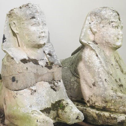 two ancient Egyptian stone sphinxes