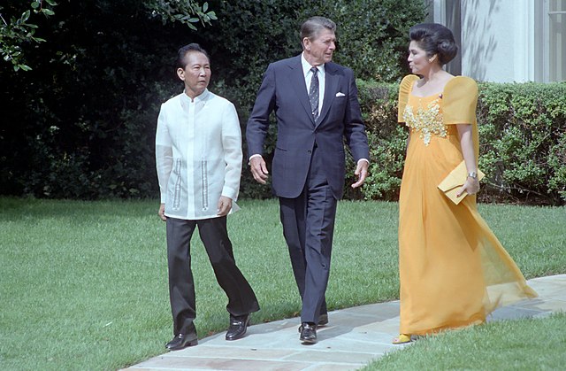 Ferdinand and Imelda Marcos with President Reagan walking on a path