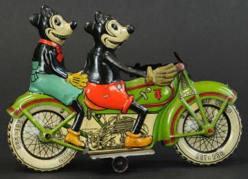 a toy motorcycle with Mickey and Minnie