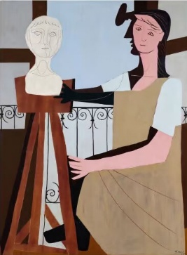 A person painting with a mask on her headDescription automatically generated