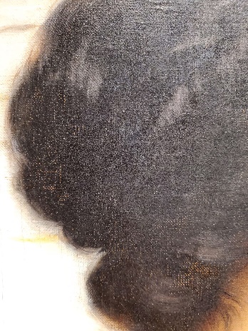 A close-up of a person's hairDescription automatically generated