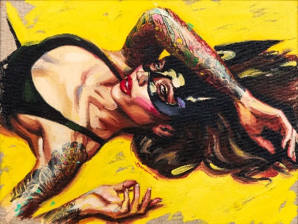 A person lying on the ground with tattoos on her faceDescription automatically generated